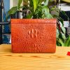 Clutch gù da cá sấu nâu đỏ dành cho quý ông tinh tế.
