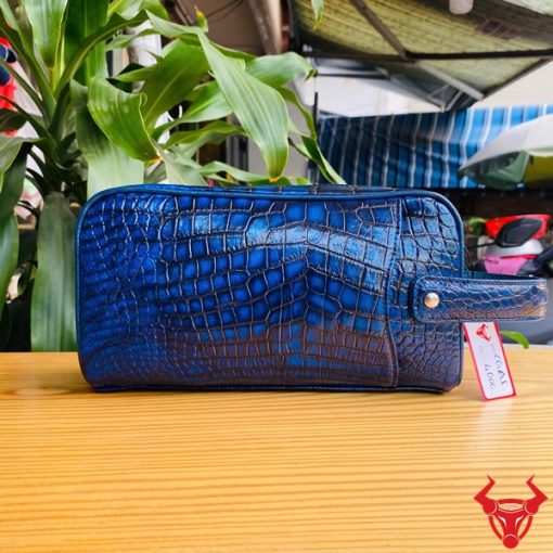 Túi clutch hộp da bụng cá sấu màu xanh patina cho quý ông đẳng cấp.